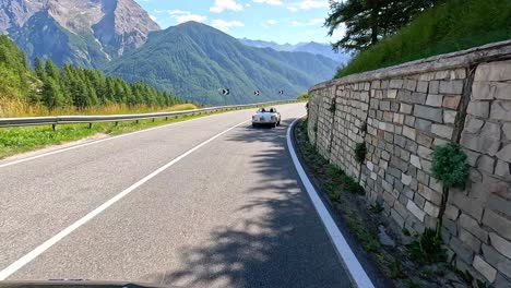 car driving through scenic mountain road