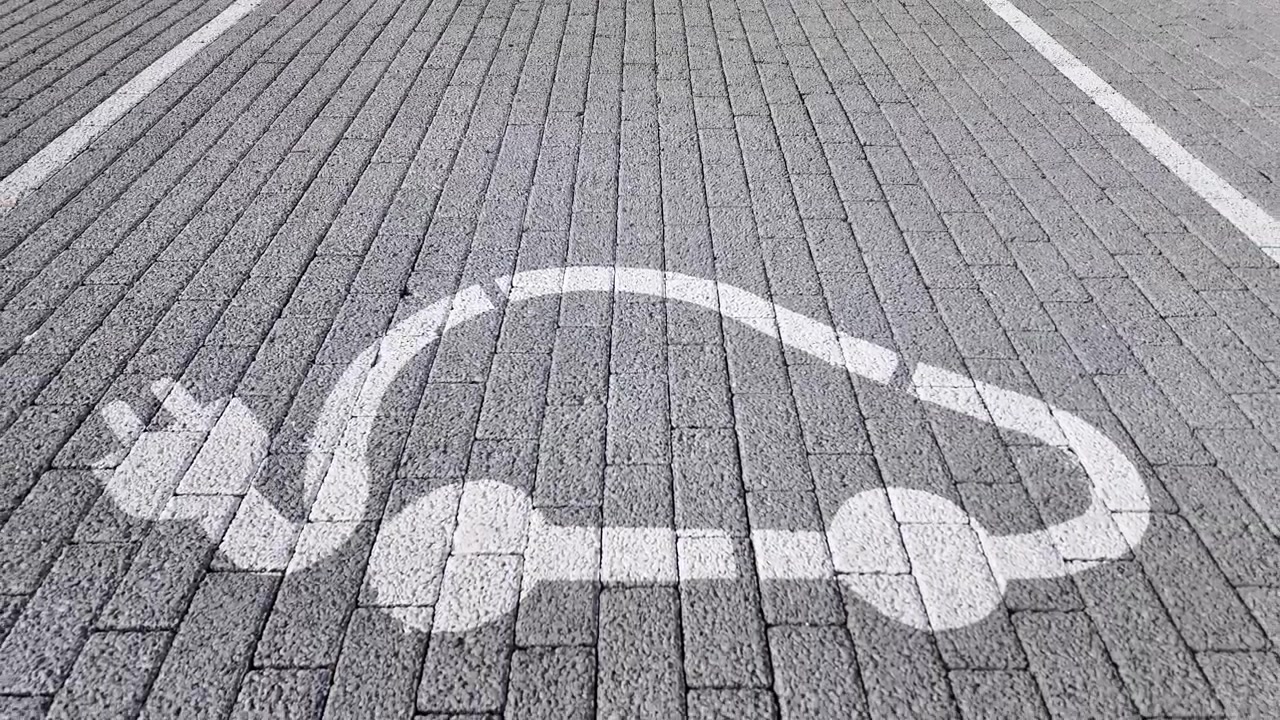 EU eletric car charging station symbol. Handheld gimbal shot.