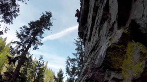 mountaineer rock climbing on the cliff 4k