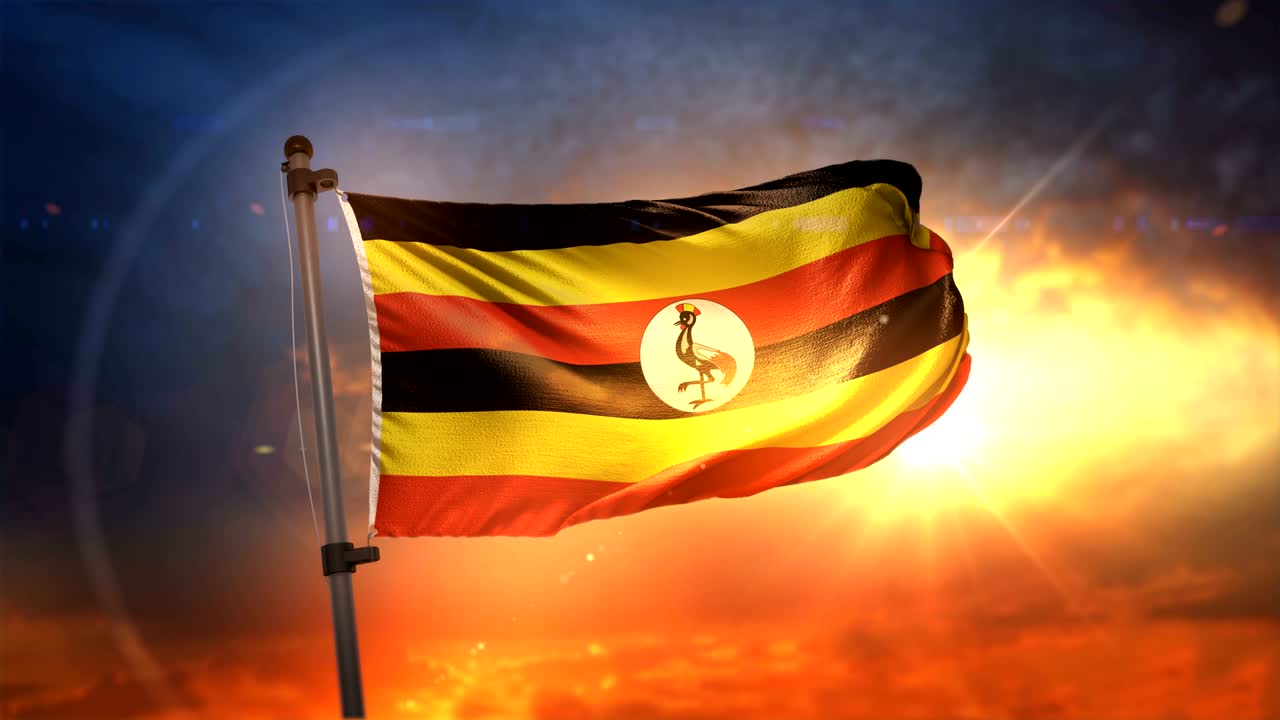 bandera de uganda retroiluminada en el hermoso amanecer bucle cámara lenta 4k