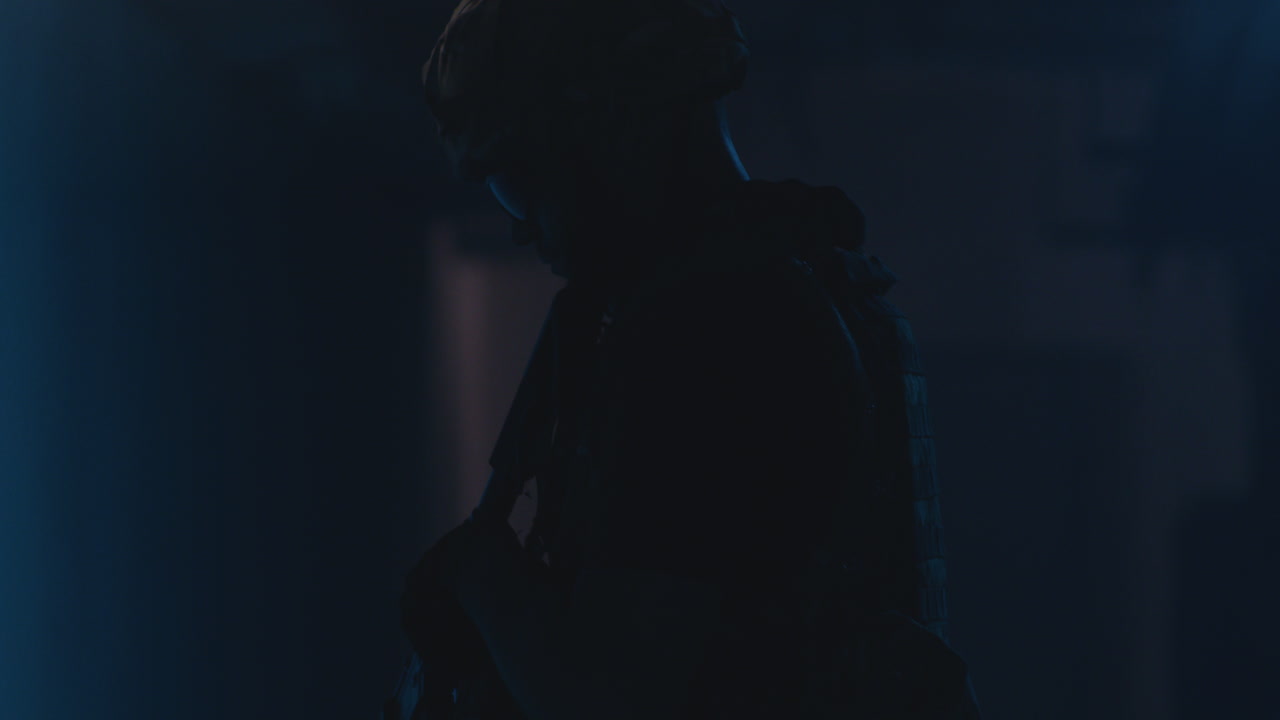 Military Personnel in Dark Setting