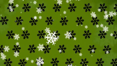 Animation-of-falling-snowflakes-on-green-background