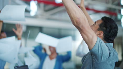 business people throw paper in air for success