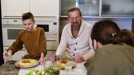 caucasian men and boy in the kitchen