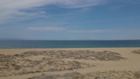 4k moving forward clip over a peninsula on the tropical beach of epanomi, halkidiki, greece