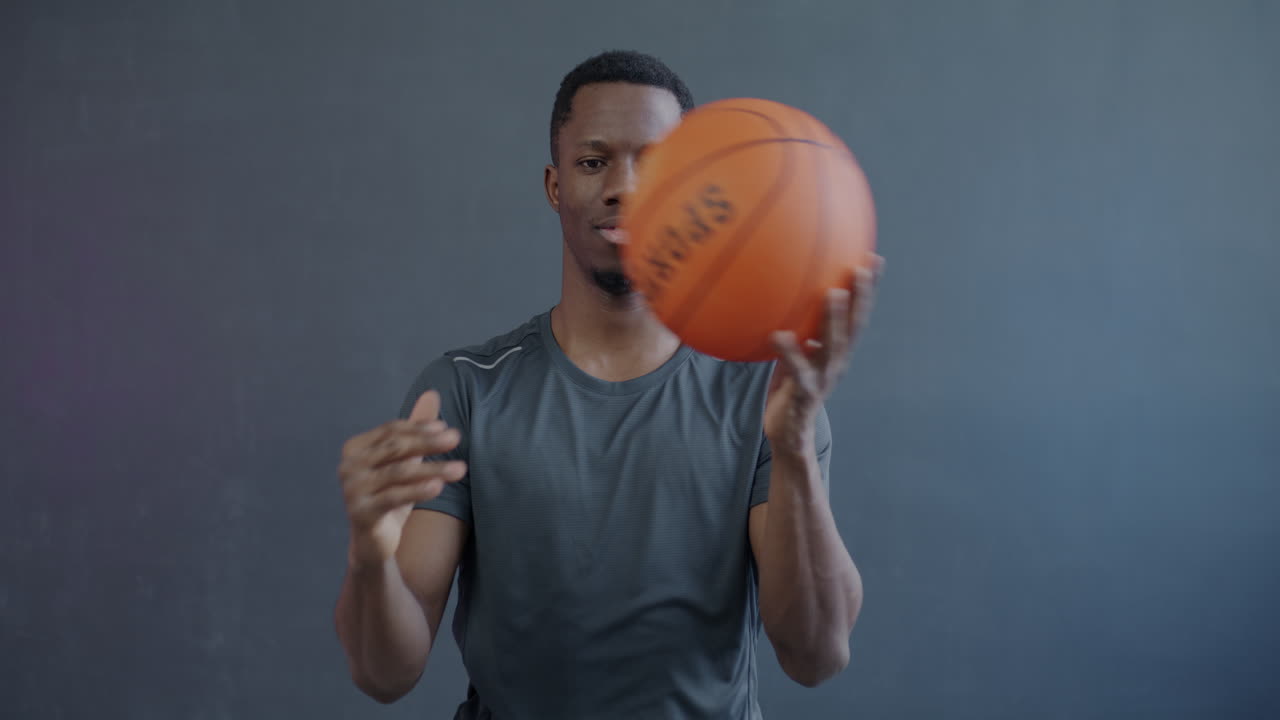 Man practicing basketball