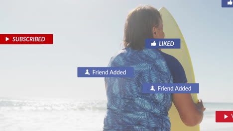 senior woman standing on sunny beach holding surfboard showing animated social alerts for marketing