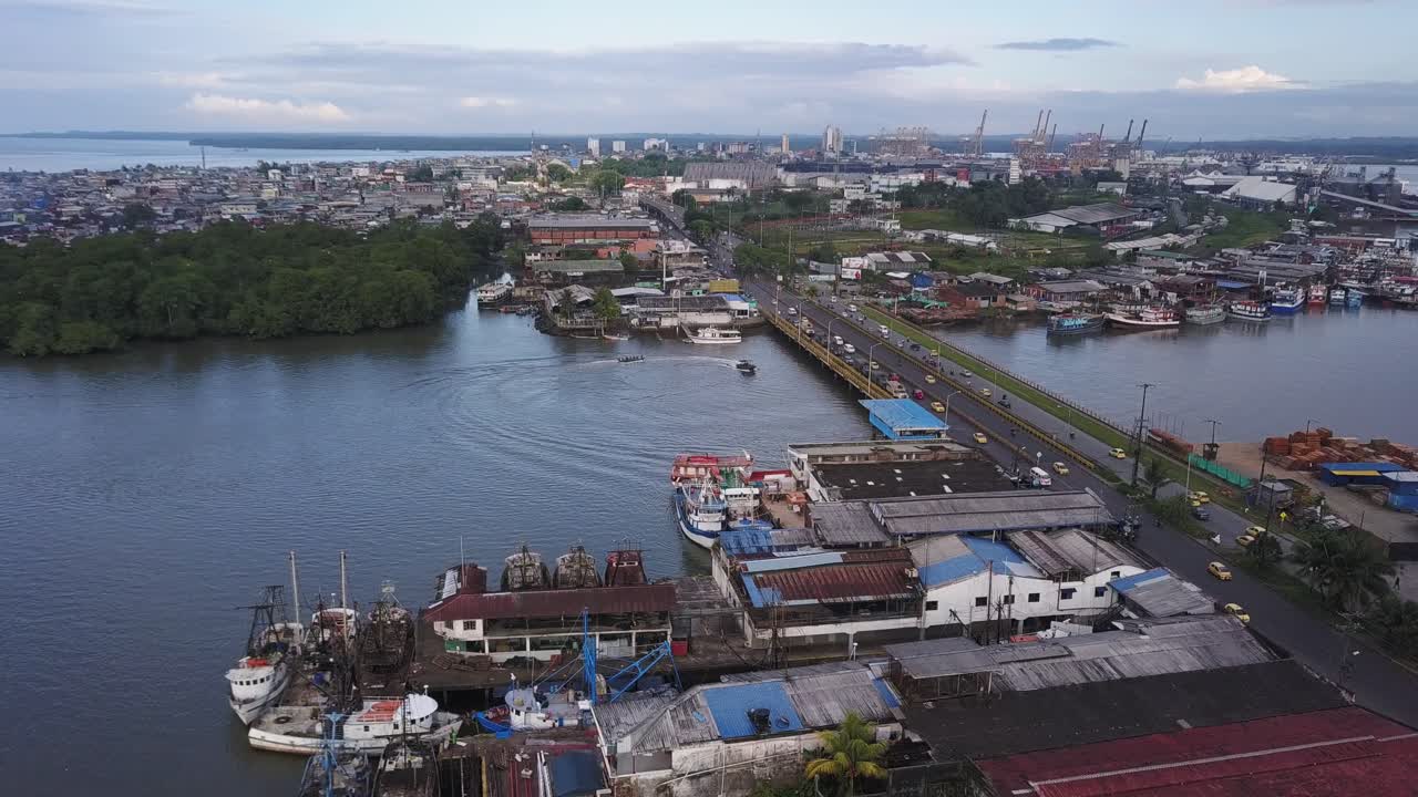 Aerial from right to left over bridge in Buenaventura, Colombia