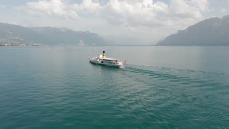 cinematic aerial of a beautiful cruise ship on lake geneva, switzerland