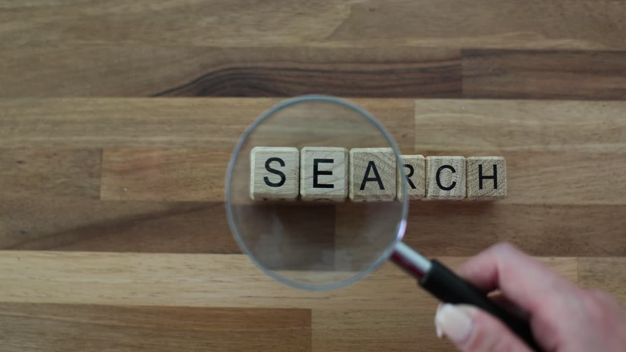 Magnifying Glass Over 'SEARCH' Text Blocks
