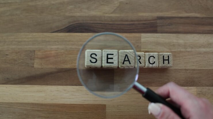 Magnifying Glass Over 'SEARCH' Text Blocks