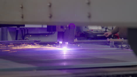 cnc plasma machine cutting metal plate slow motion wide shot