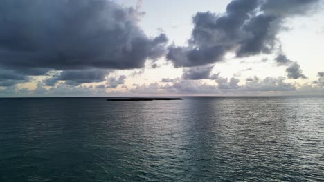 Aerial:-Popoia-Island-ahead,-birds-flapping,-Oahu,-Hawaii