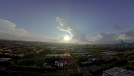 fpv aerial drone footage of a local chicago neighborhood during sunset. the urban area is covered in a vibrant green forestry.