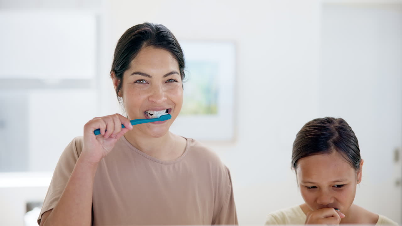 Happy mother, kid and brushing teeth in bathroom