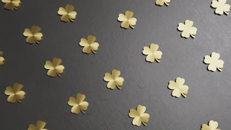 golden four-leaf clover on black background good luck 3d rendering animation endless loop