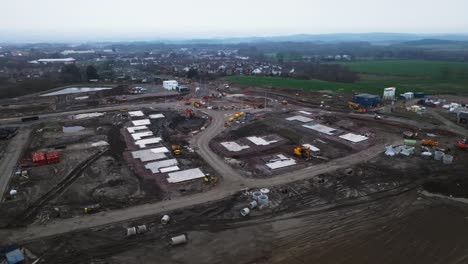 slow arcing shot of housing plots on a construction site during a housing crisis