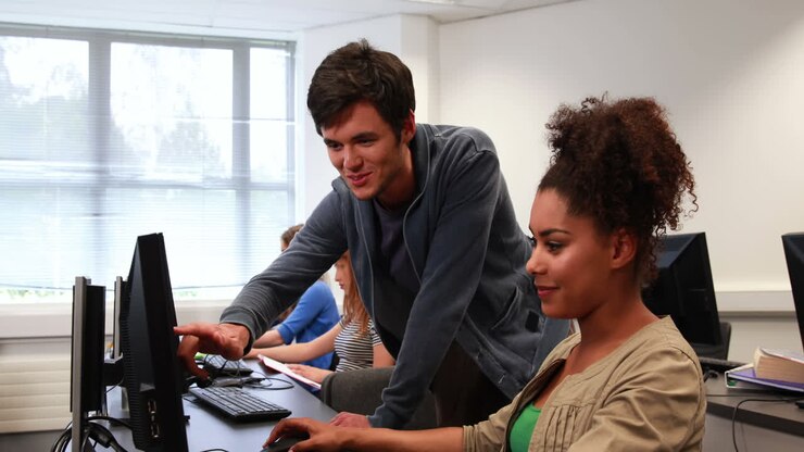 Students working together in computer room