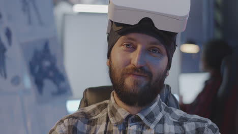 man wearing vr headset in office