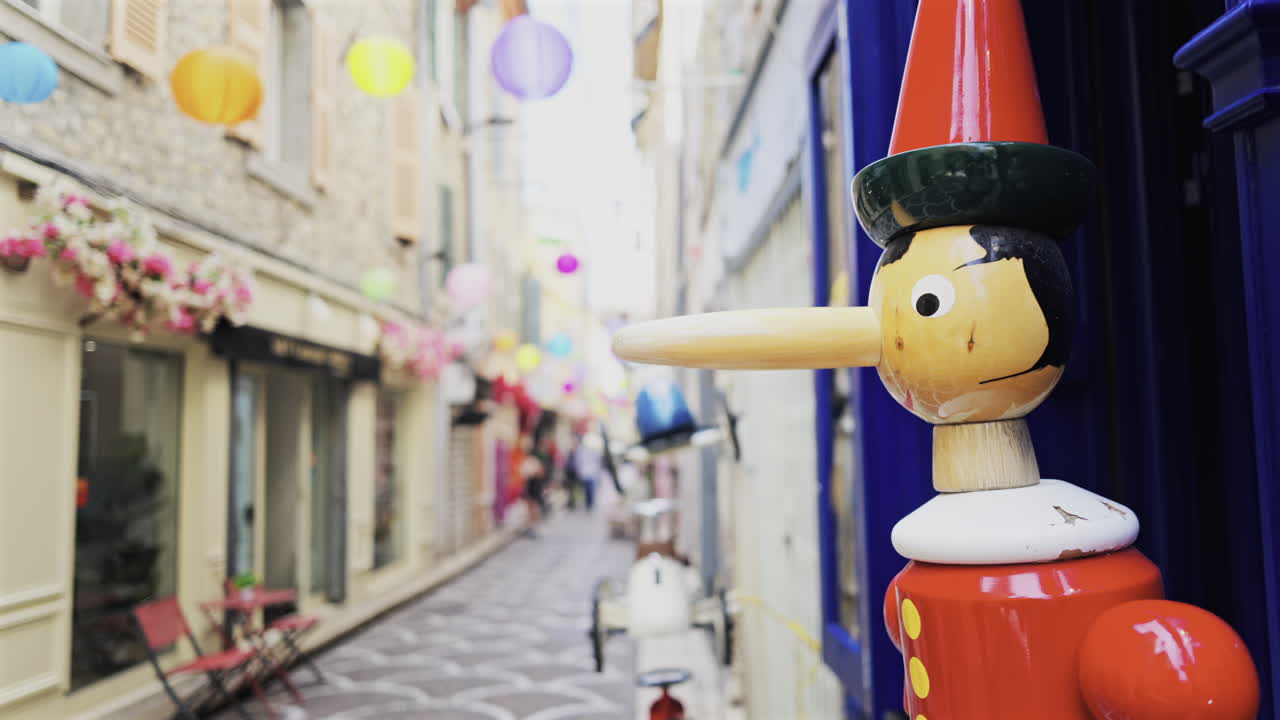 Pinocchio sculpture made out of wood on the streets of Antibes, France