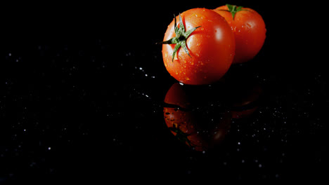 fresh tomatoes on black background 4k