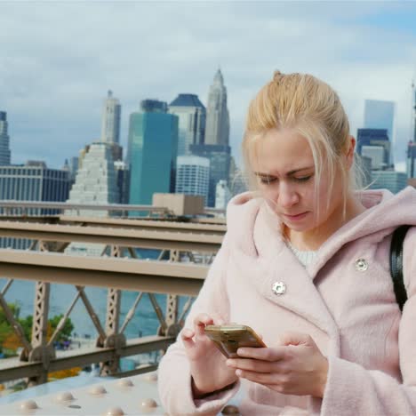 a young woman uses a smartphone