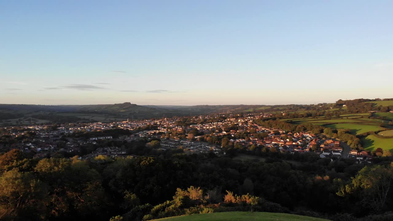 Aerial left panning shot over the East Devon Countryside in the warm glow of a beautiful sunset