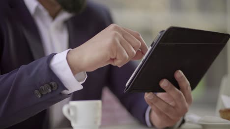 cropped shot of businessman using digital tablet