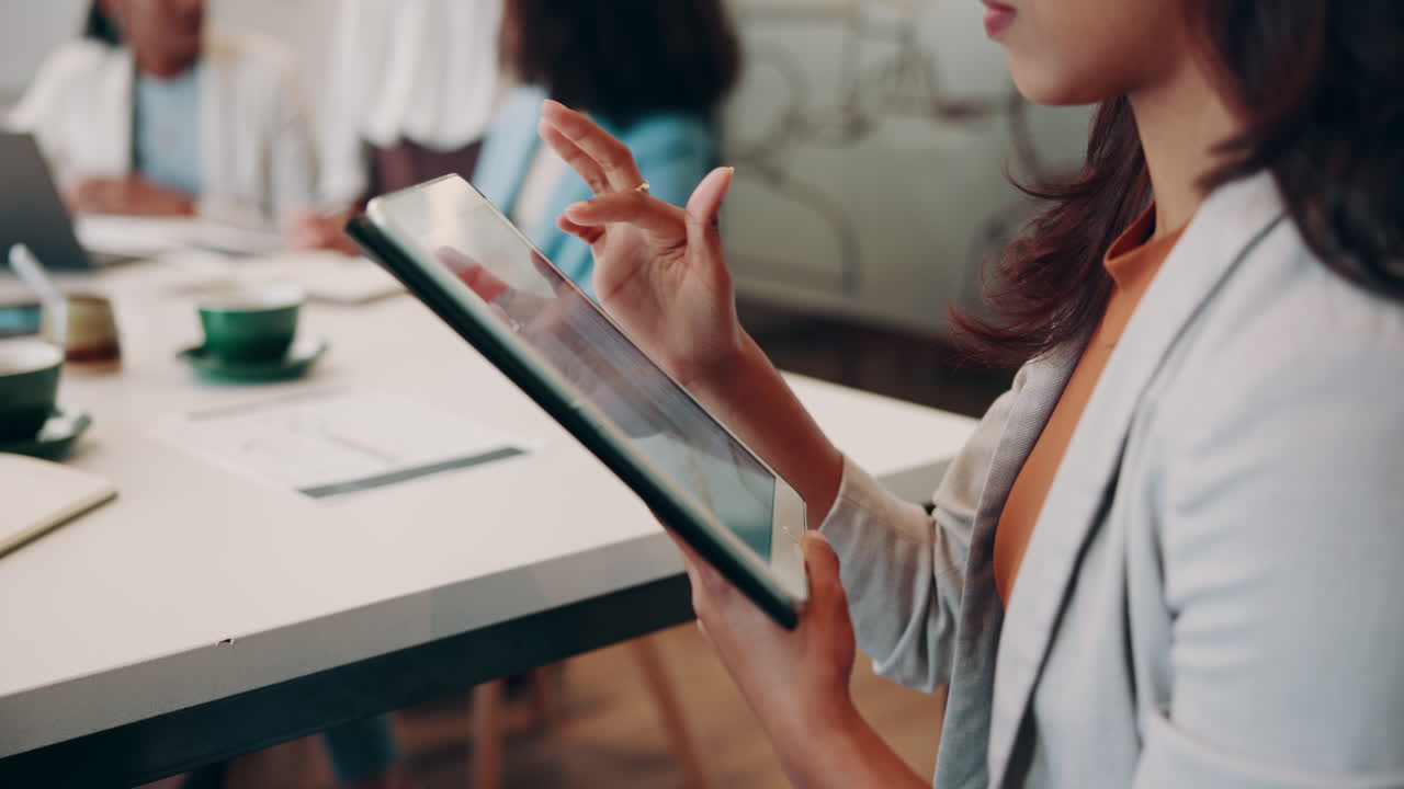 Businesswoman Using Tablet During a Meeting