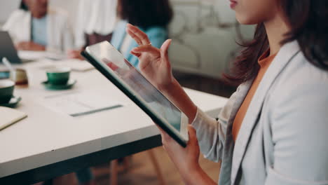 Businesswoman Using Tablet During a Meeting