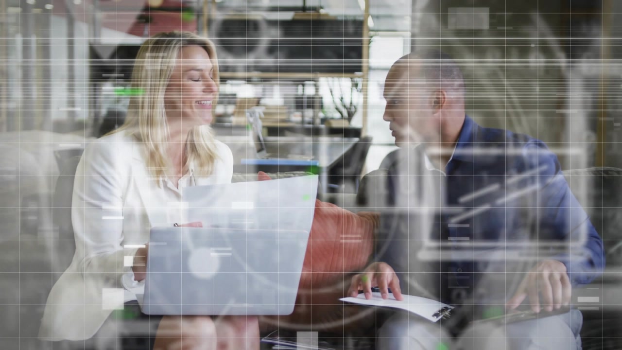 Man sliding paper to woman, team exchanging laptop, woman typing, HUD growing, reaching agreement