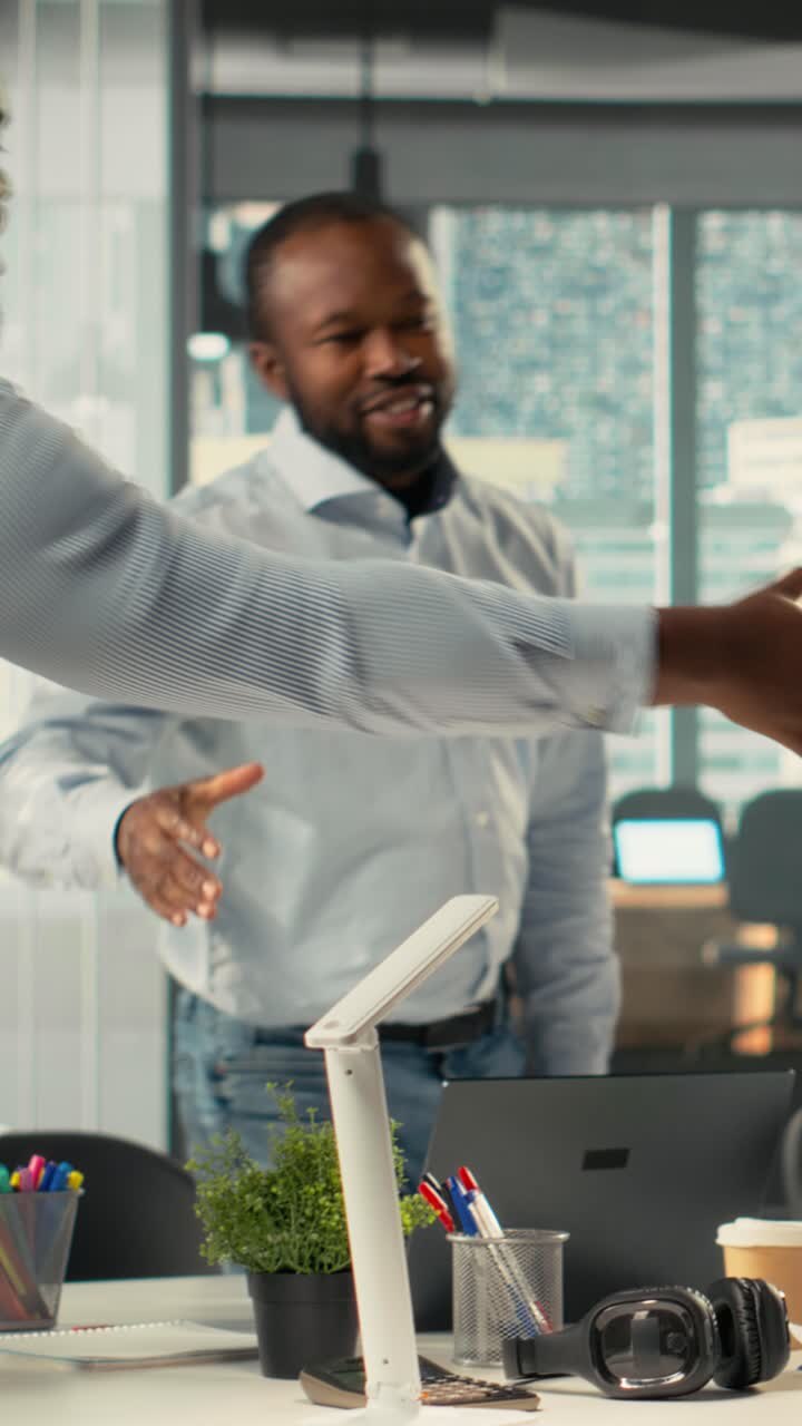 Vertical Video Multinational company staff engaged in a corporate event for business partnership