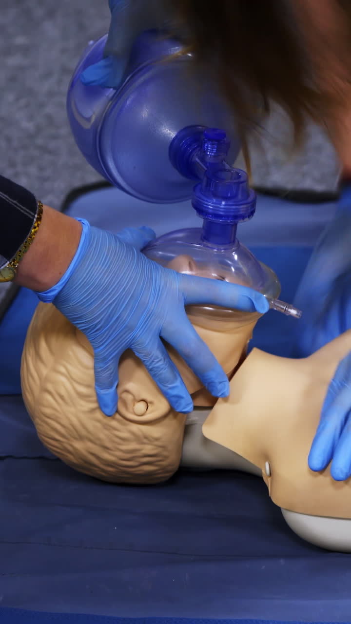 Training medical procedure workshop. Cardiopulmonary resuscitation and first aid class. Vertical video