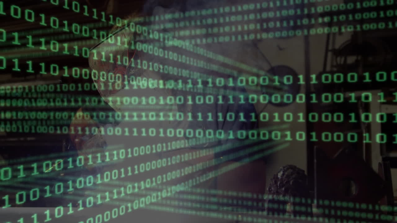 Programmer wearing glasses coding at desk under binary code overlay, showing technology brain model