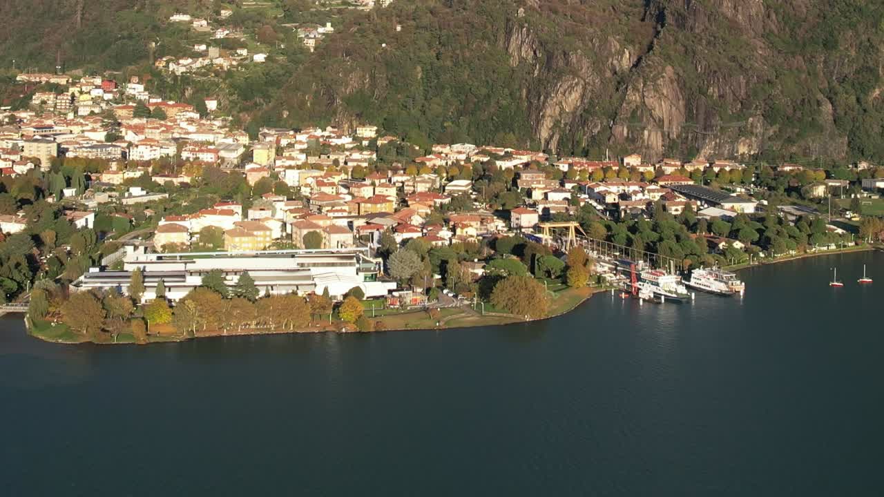 Stunning aerial view of Italian Alps and lakeside town in autumn