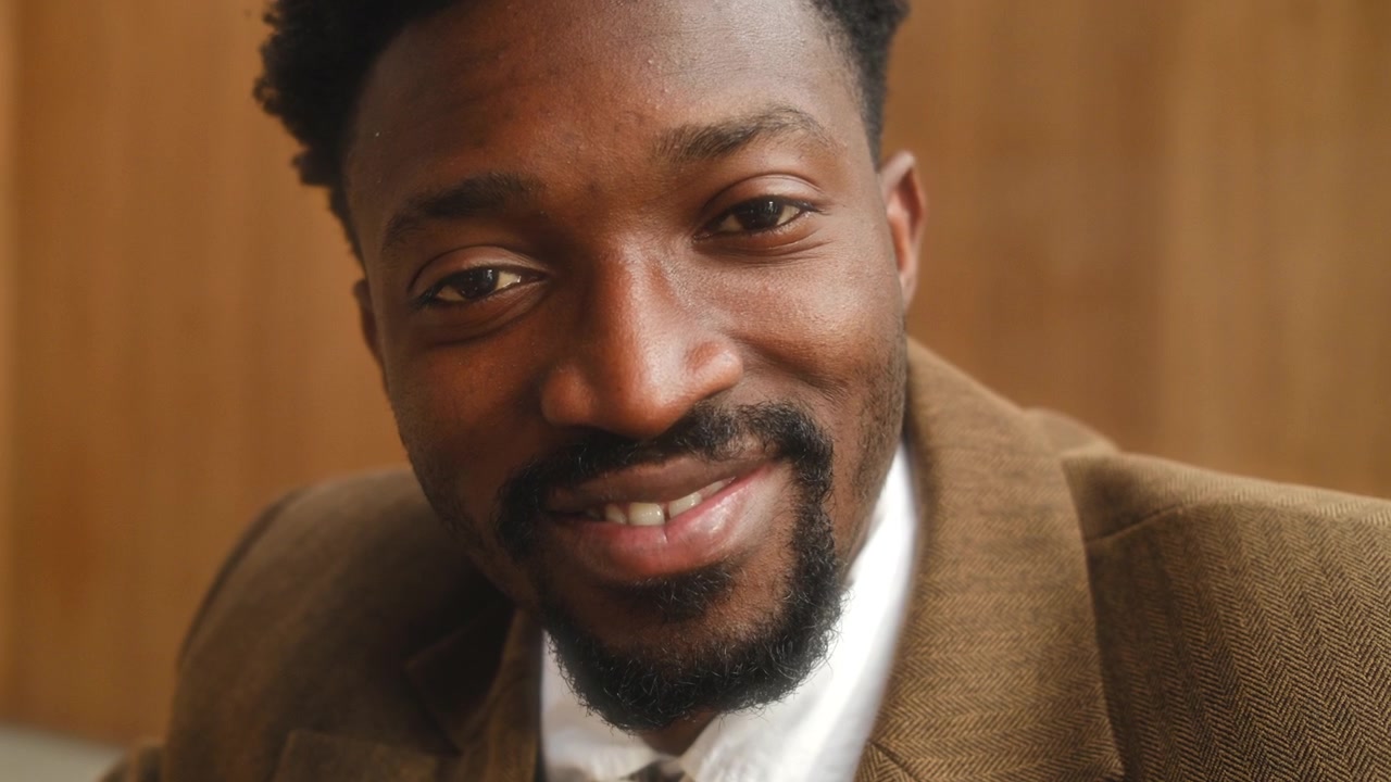 Close Up Portrait of Smiling Friendly African American Businessman