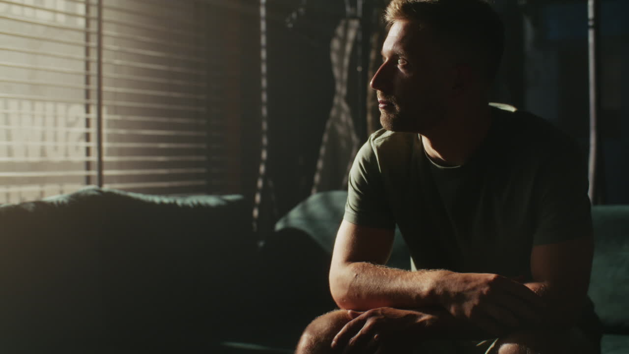 Man Sitting on a Sofa Contemplating