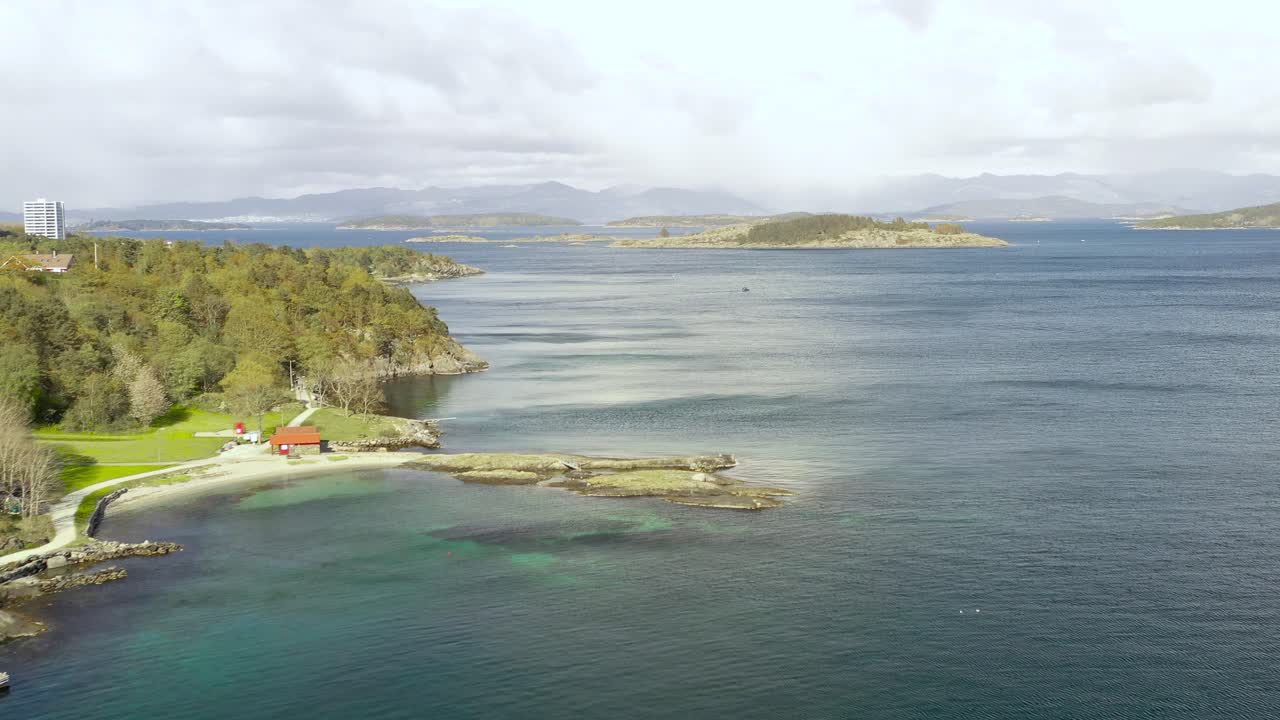 Stavanger City Seaside. Drone Aerial View of Green Coast of Old Capitol of Norway on Spring Sunlight