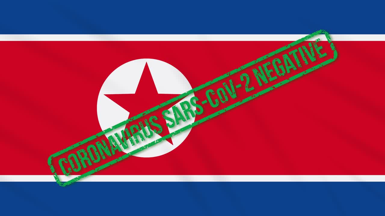 북한이 코로나 바이러스로부터의 자유를 표시하는 초록색 발을 흔들고 있다.