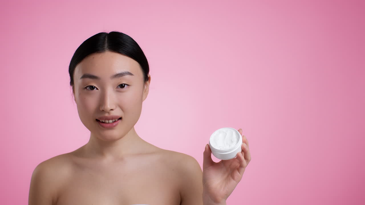 Woman holding a beauty cream