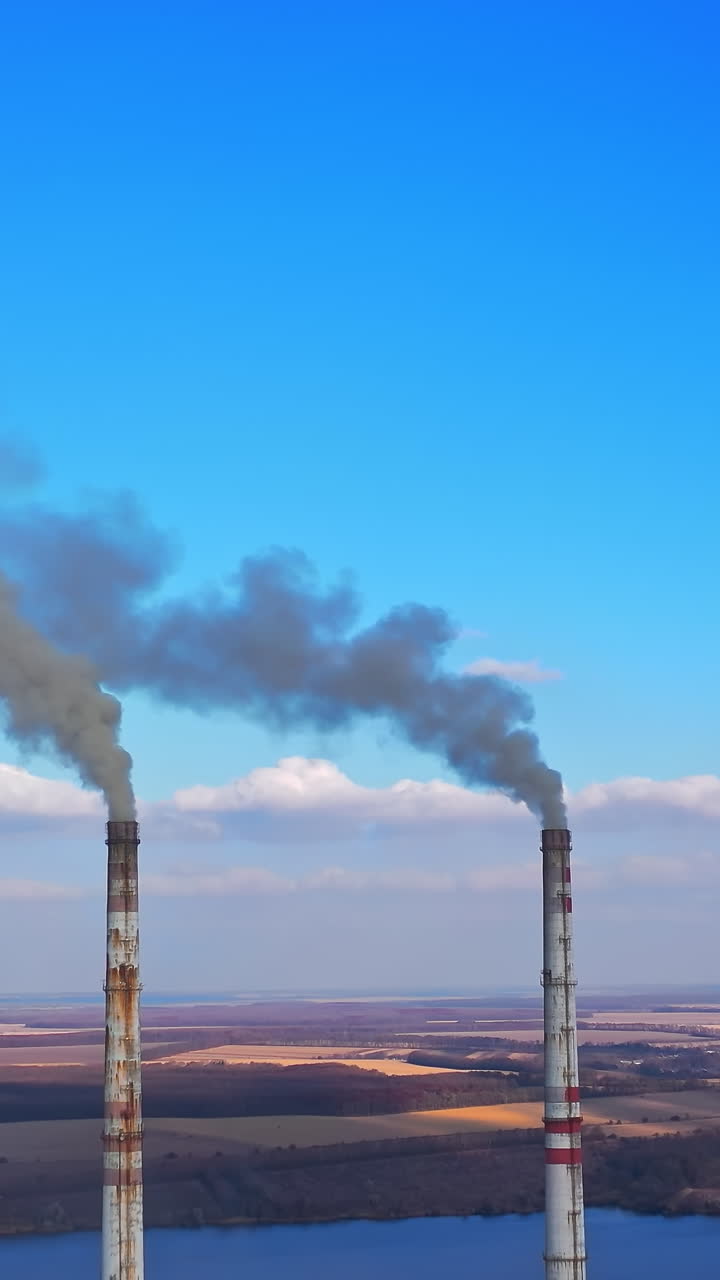 Smoking from factory tube. Toxic production company enterprise. Full length view Vertical video