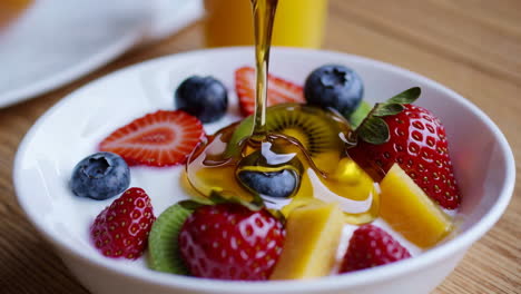 honey yogurt parfait with assorted berries and fruits