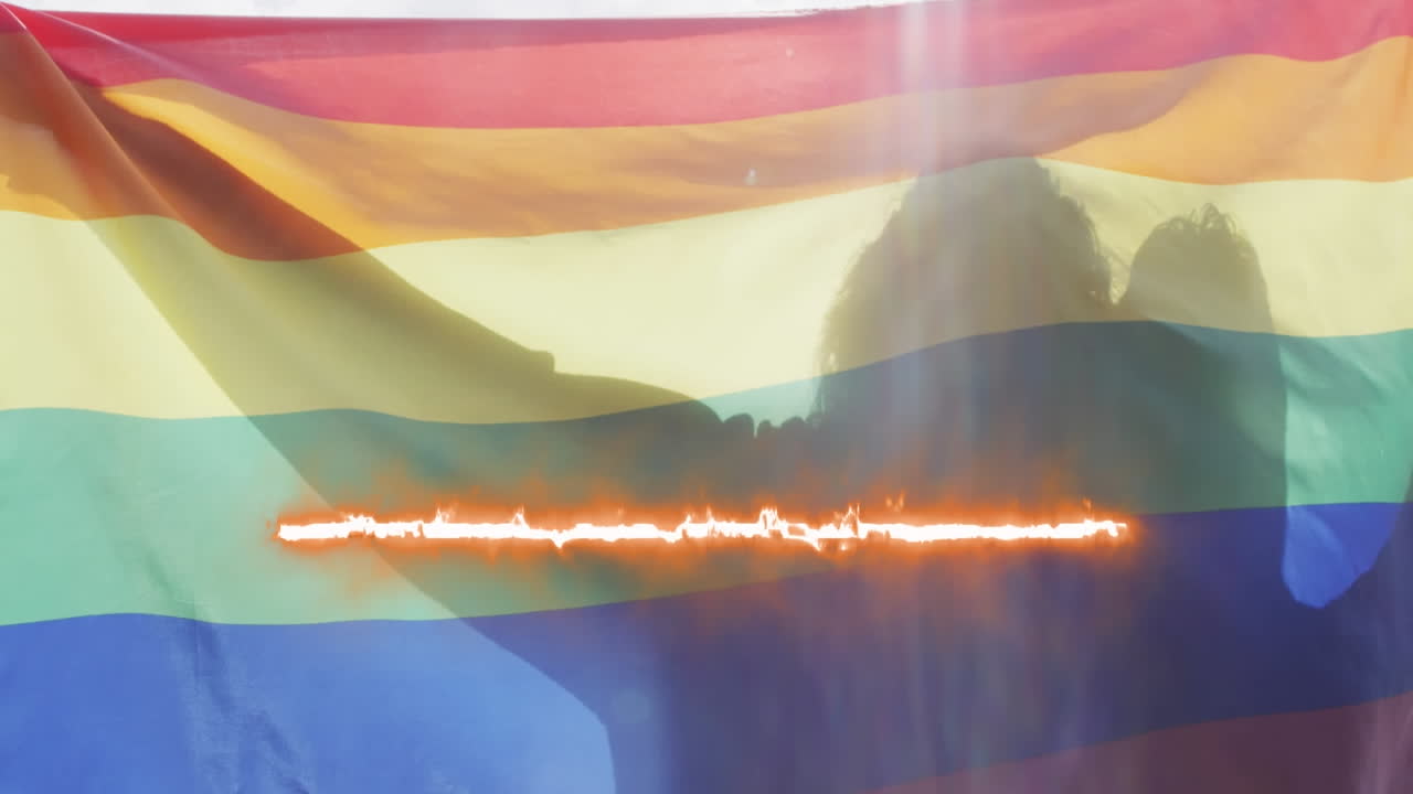 animación de senderos de luz sobre personas que sostienen la bandera lgbt