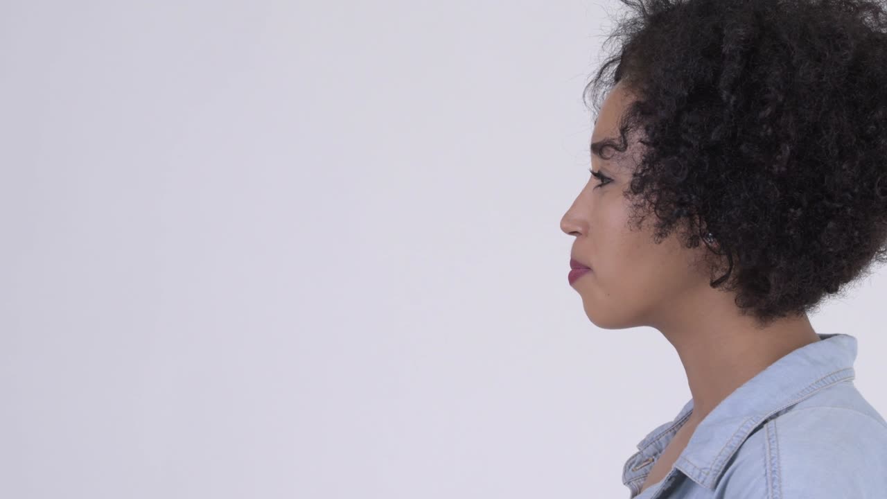 Closeup profile view of happy young beautiful African woman