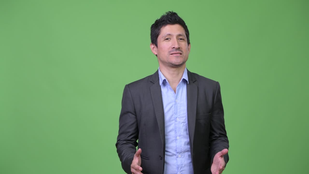 Hispanic businessman talking and promoting