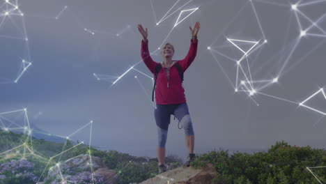 animation of networks of connections over senior caucasian woman hiking in countryside