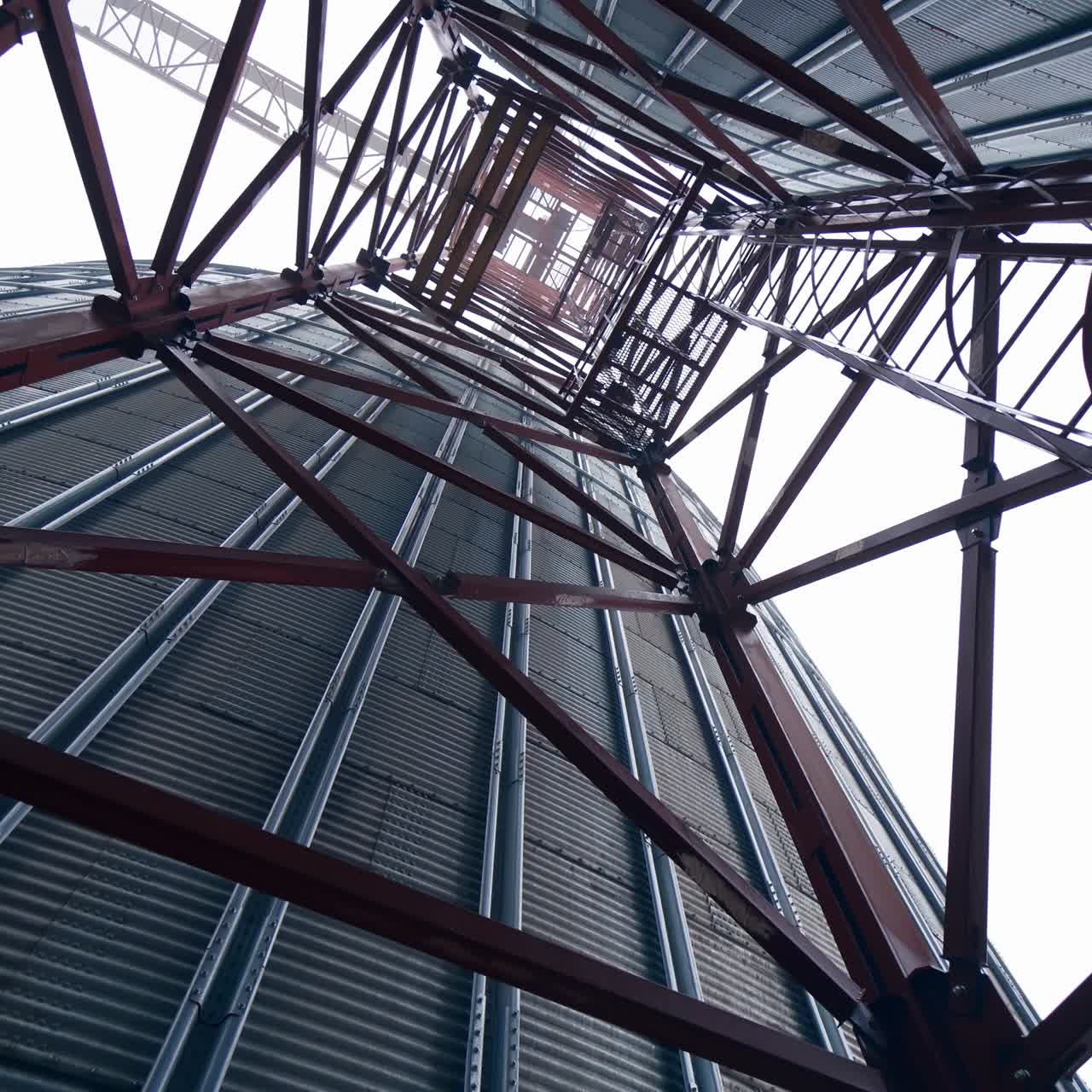 Big factory elevator construction. Storage granary technology tank