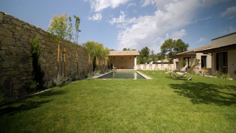 slow rising shot revealing a private pool with sun loungers in st siffret
