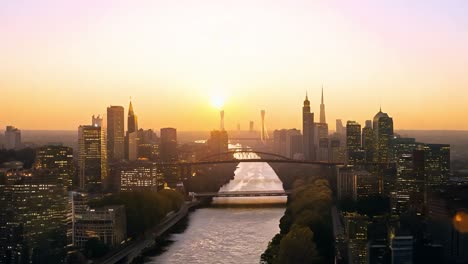 sunrise illuminating a city skyline, casting reflections on the river and transitioning from night to a bright morning