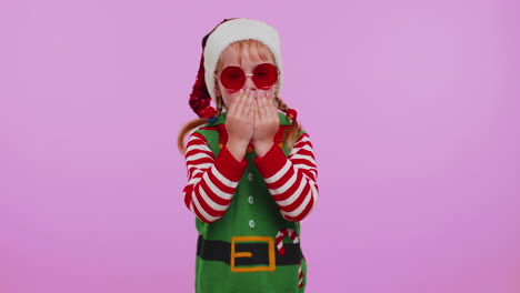 Girl-Christmas-Santa-Claus-Elf-listening-music-via-earphones-dancing-disco-fooling-around-having-fun